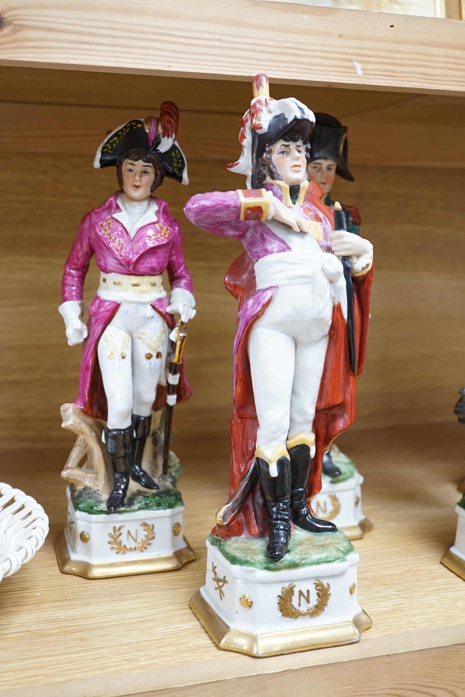 Six continental porcelain figures of soldiers, 32cm